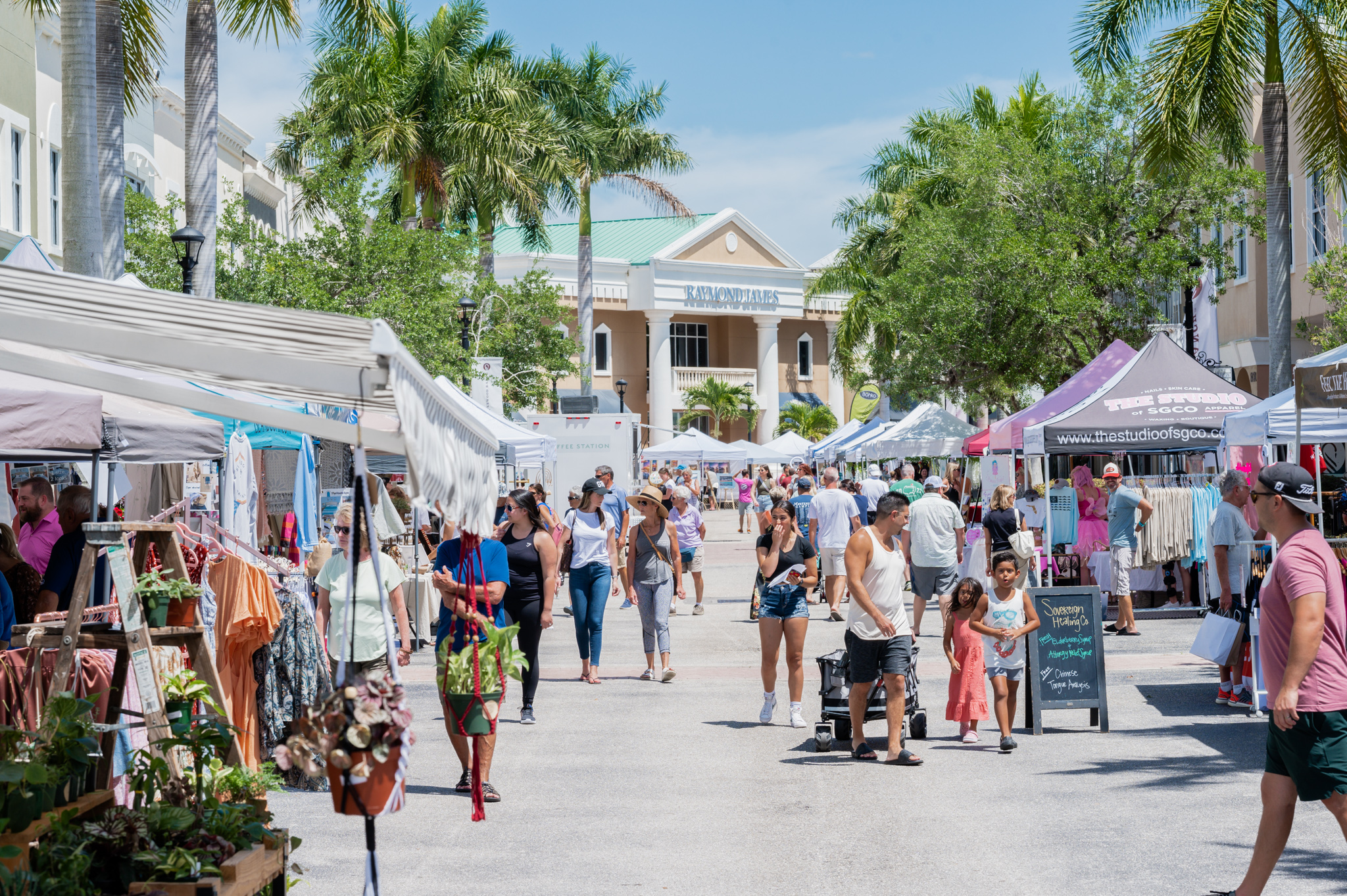 People walking through an outdoor market