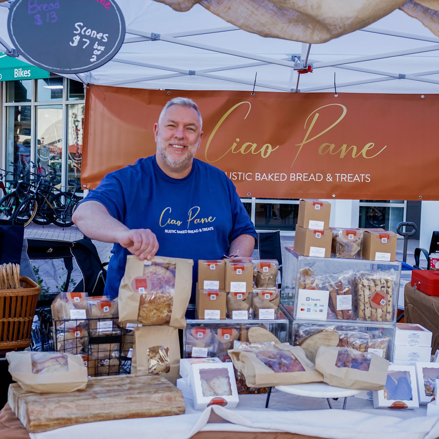 Vendor selling goods at an outdoor market