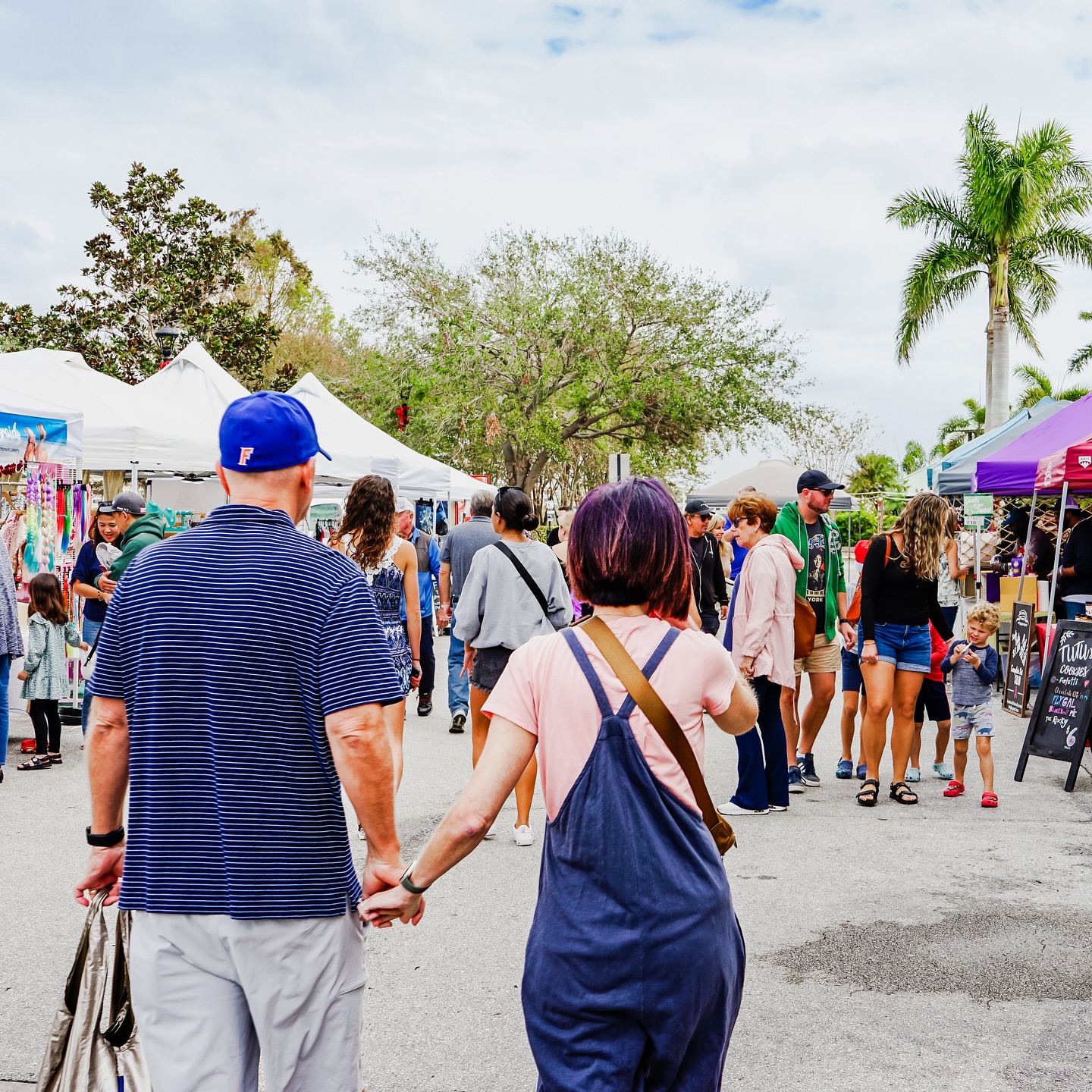 People walking through an outdoor market