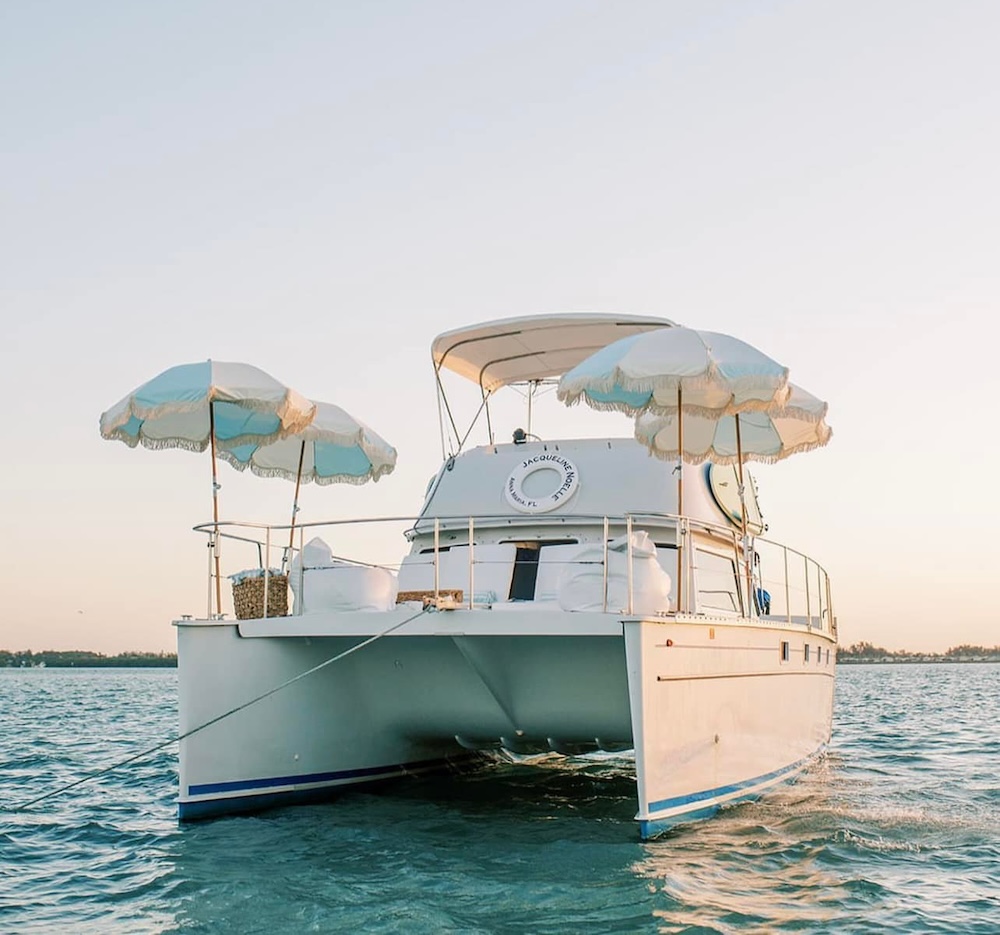 Date Night a boat with umbrellas on the water