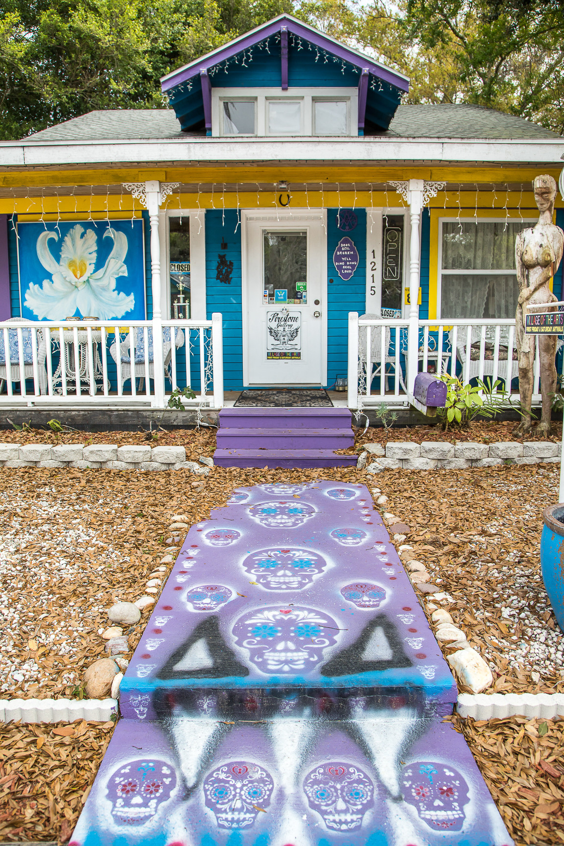 Explore the Gulf Island Ferry Stops a brightly painted bungalow home with painted sugar skulls for decoration