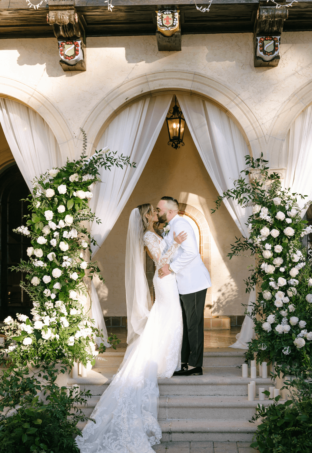 Powel Crosley bride and groom kissing at the altar on their wedding day